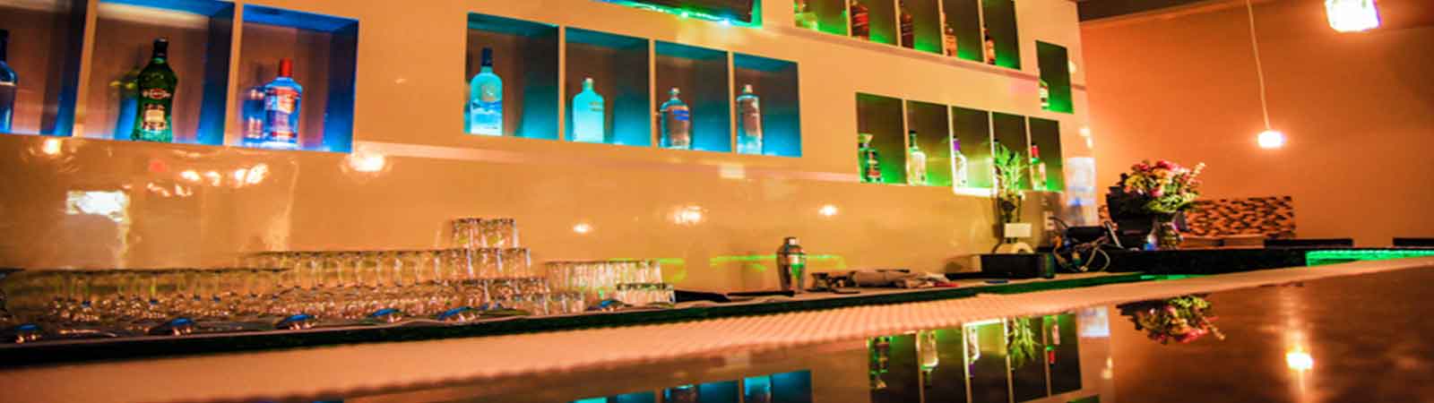 view of bar with liquor bottles